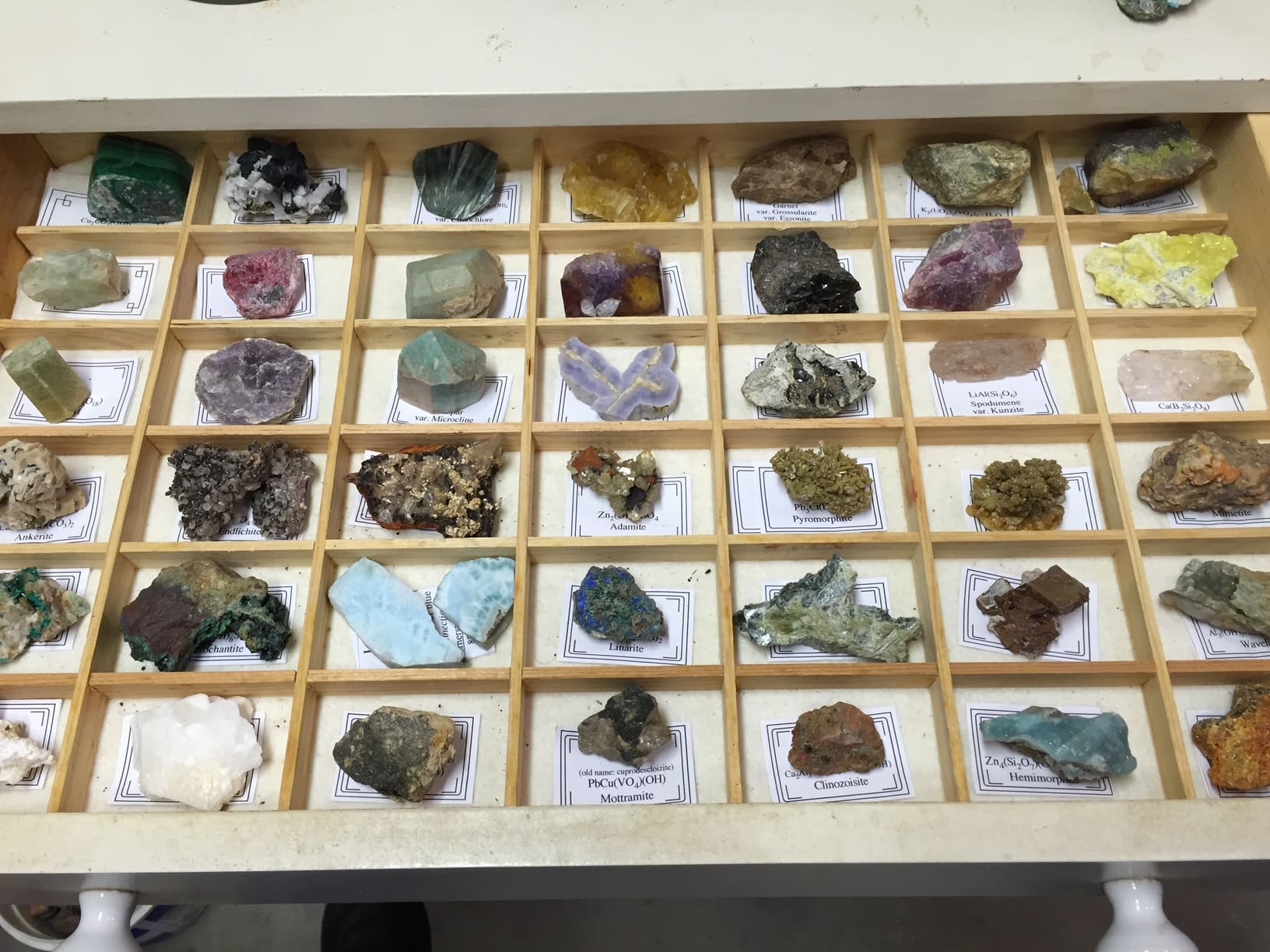 Colorful semi-precious stones in display trays